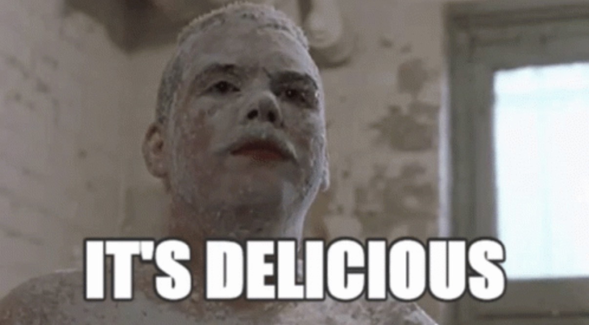 Farva from Super Troopers covered in powdered sugar and saying ‘it’s delicious’
