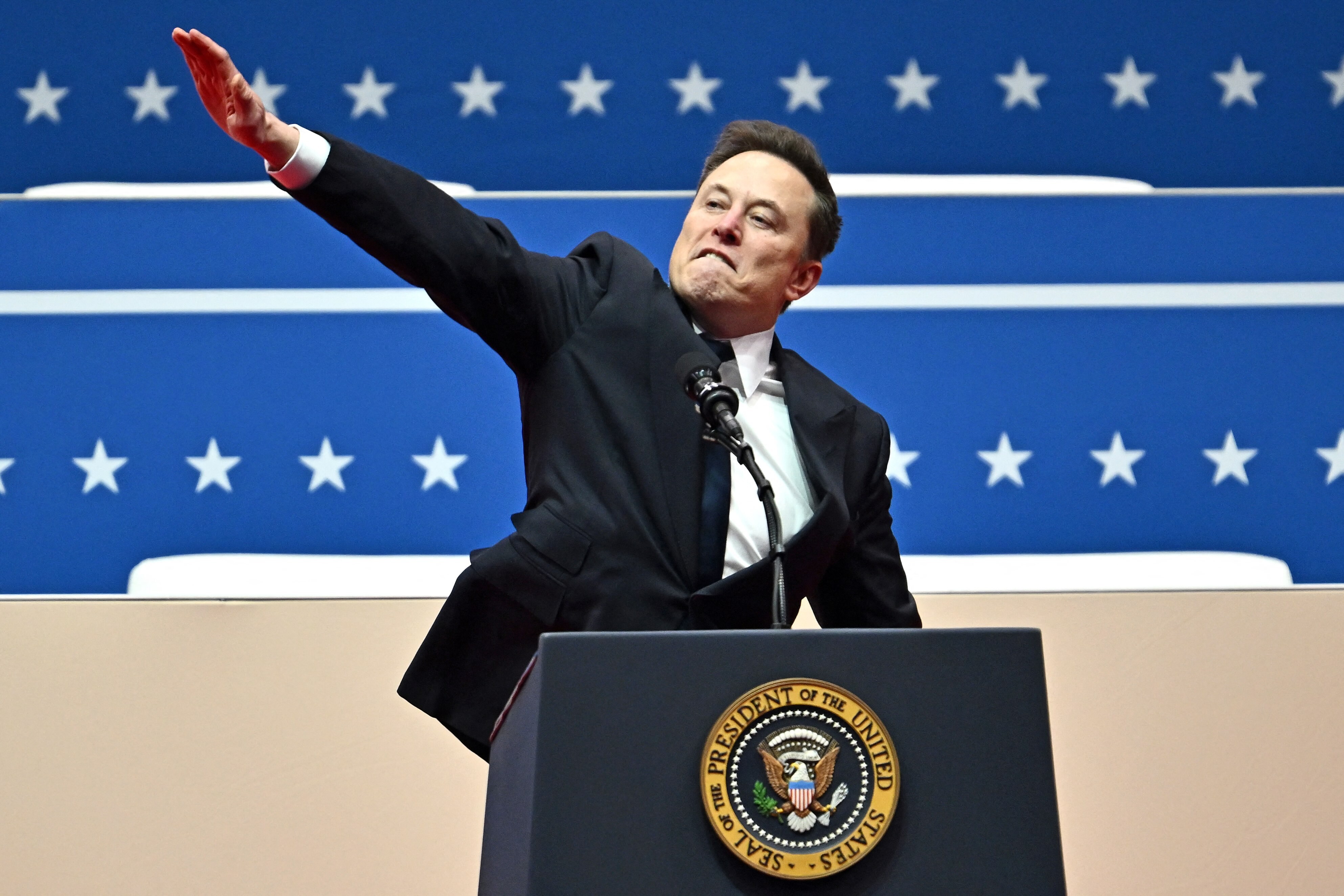 Elon giving a Nazi salute because he’s a fucking loser with no friends